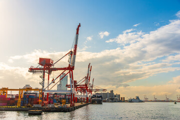 Container port and container crane at Industrial port for cargo container ship Osaka Japan. Business logistic transportation concept.