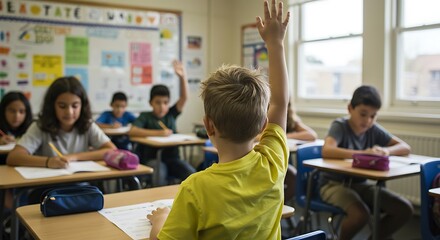 A young student raises their hand in class.
