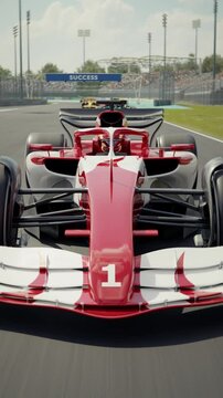 Dynamic front view shot of a generic formula one race car driving along the homestretch over the finish line. High to low angle front view camera. 3D animation rendering