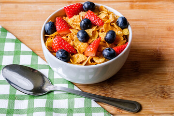 Bowl Of Classic Corn Flakes Breakfast Cereal With Fresh Strawberries and Banana