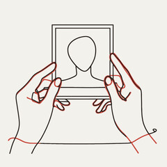 Hands holding photo frame
