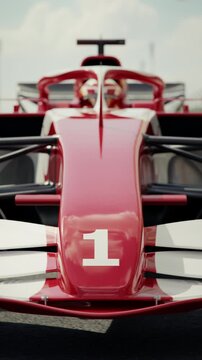 Front view of a generic formula one race car rolling into pole position. 3D animation rendering