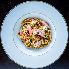 A vibrant seafood pasta with fresh ingredients and a captivating presentation