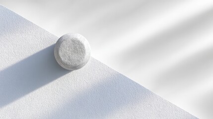 White Sphere with Strong Shadow on Textured Surface