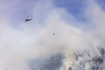Helicopter Fighting Forest Fire in Smoky Squamish, BC, Canada, Scenic Aerial Capture