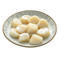 Delicious slices of tender coconut meat on a decorative plate ready for consumption