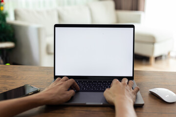 mock up businessman working empty screen computer on wood desk in home. Notebook Laptop with blank screen