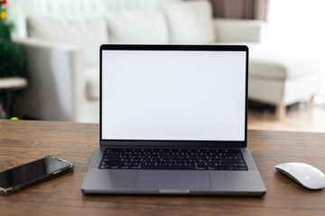mock up empty screen computer on wood desk in home.Notebook Laptop with blank screen