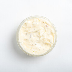 Silky, white dip in a glass bowl offers a delightful addition to any snack table, enhancing flavors