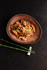 Stir-fried noodles with fresh veggies and savory chicken offer a tasty delight