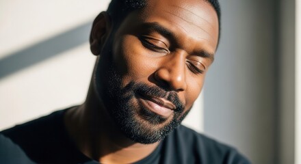 Man enjoying peaceful moment sunny window
