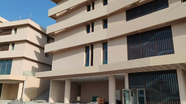 Modern design Aluminum shape Multi Baffle Cladding Decoration. Balcony Facade Architecture Panel with Black Horizontal Metal, Wood stripes. Exterior view multistory building with black glass windows.