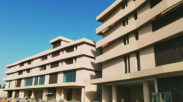 Modern design Aluminum shape Multi Baffle Cladding Decoration. Balcony Facade Architecture Panel with Black Horizontal Metal, Wood stripes. Exterior view multistory building with black glass windows.
