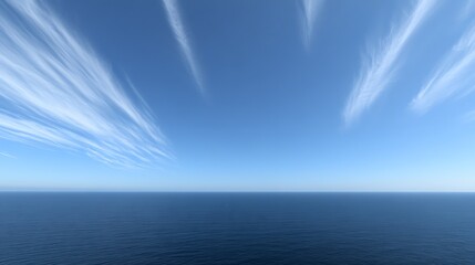 Obraz premium Vast Ocean Meets a Striking Sky Adorned with Wispy Cloud Formations