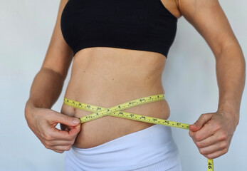 Measuring waist circumference for fitness tracking and health assessment