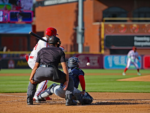 baseball batter hitting and umpire