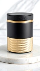 Elegant black and gold cylindrical container resting on a marble surface showcasing luxury design