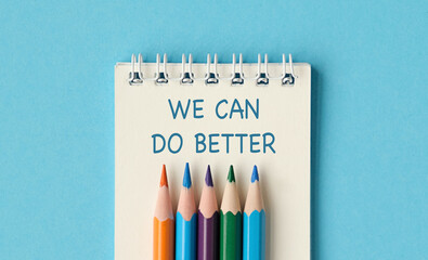 A notebook with a spiral binding and a pencils on top of it, We Can Do Better