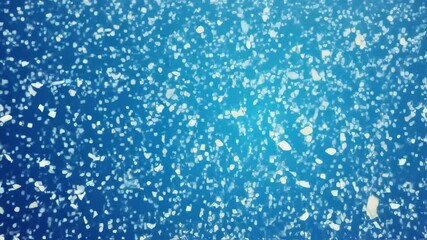 Enchanting snowfall against blue backdrop: dynamic winter movement and atmosphere - Powered by Adobe