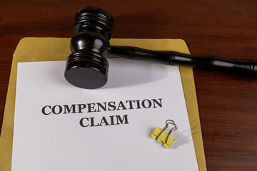 Compensation Claim Legal Document with Gavel – Workplace Injury and Legal Restitution Concept