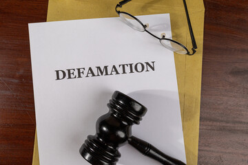 Defamation Lawsuit Document with Gavel – Libel and Slander Legal Case Concept