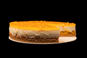 Orange cheesecake isolated on a white background.