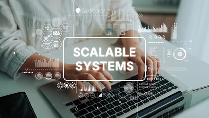 Business Professional Analyzing Data on Laptop with Overlay of Scalable Systems Graphics and Icons....