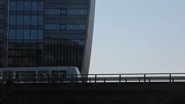 Copenhagen, Denmark An elevated Metro train on the M1 line passes the modern buildings in the Orestad district.  