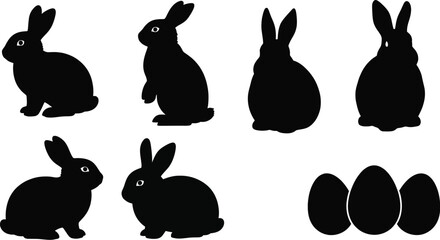 A collection of black silhouettes featuring bunnies and easter eggs arranged on a plain white background scene
