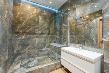 stylish bathroom features a marble-tiled shower with glass enclosure, a modern white vanity, and a...