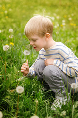 Cheerful child surrounded by blooming dandelions in spring meadow. Light, joy, and a sense of wonder in nature.