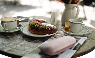 Cozy terrace breakfast with coffee and croissant