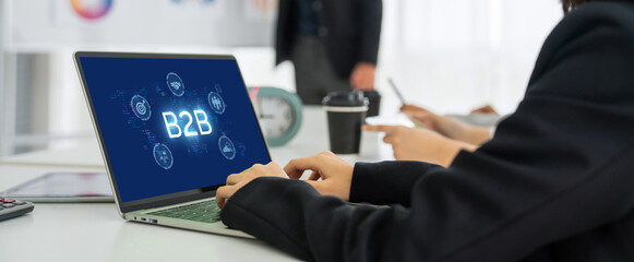 Business person navigates B2B landscape, harness technology to enhance business-to-business...