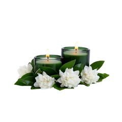 Two green candles are lit, surrounded by white flowers and green leaves, creating serene and calming atmosphere. arrangement is perfect for relaxation or meditation settings