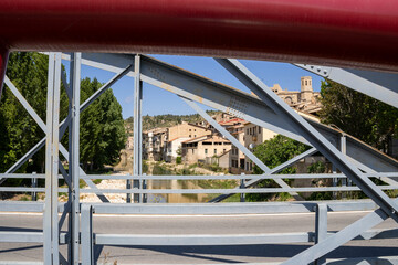 Old iron bridge crossing the Matarraña River in Valderrobres, Aragon. Spanish medieval charm and...