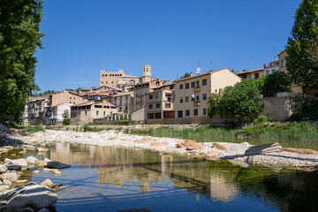 Fototapeta premium Picturesque Spanish village Valderrobres with old stone bridge and iconic castle and church skyline, in Teruel region.