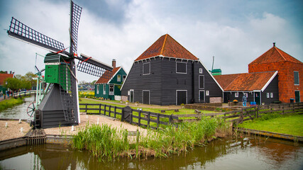 old dutch village with canals and windmills