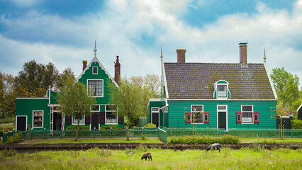 old dutch village with canals and windmills
