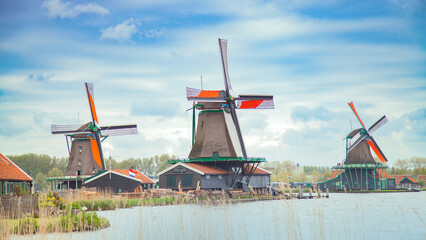 old dutch village with canals and windmills