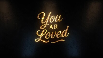Golden 3D "You Are Loved" text with elegant swirls and light reflections, creating a warm, uplifting message on a dark background with a glowing, welcoming feel.