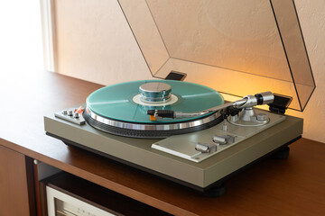 AKAI Vintage Stereo Turntable Record Player With Colored Disk and Weight Clamp Sitting on Wooden...