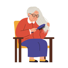 Elderly woman brushing her hair while sitting in armchair indoors  