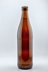 a brown beer bottle made of glass