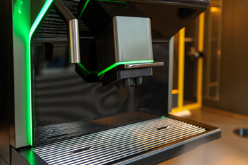 Close-up of coffee dispenser and drip tray