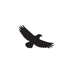 Eagle flying in black vector silhouette with wings spread in freedom