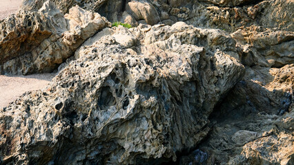 Rocks of the Mediterranean Sea in the port of the French city of Banyuls-sur-Mer, vacation in Europe, summer