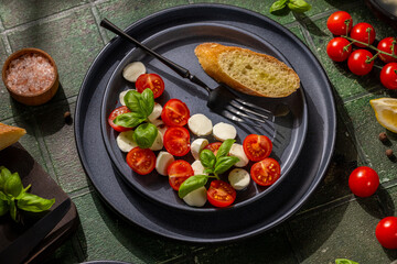 Fresh caprese salad with cherry tomatoes and basil