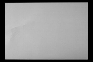 New blank white paper sheet isolated on black background and texture, top view	