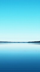 Tranquil lake, clear sky