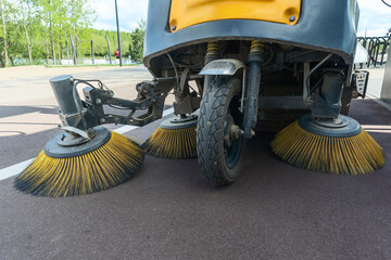 Innovative electric street sweeper efficiently cleaning pedestrian walkways and bike paths for a...